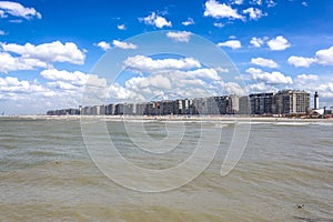 North sea coastline in Blankenberge with many touristic appartments dueing summer with beautiful blue sky