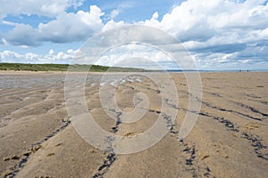 North Sea at the Crimdon beach, Hartlepool and Seaton Carew, England. Dark blue sky and sandy beach in United Kingdom