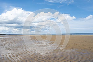 North Sea at the Crimdon beach, Hartlepool and Seaton Carew, England. Dark blue sky and sandy beach in United Kingdom photo