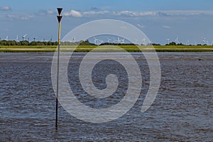 North sea dune landscape with wind turbines