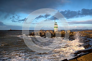 North sea waves and lighthouse in Ijmuiden