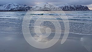 Ramsberg beach on Flakstad island on the Lofoten islands in winter at sunset photo