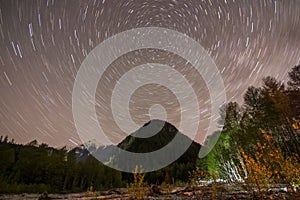 North star/polaris and star trails with mountain landscape in Squamish, British Columbia, Canada