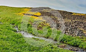 North Table mountain landscape featuring a creek, rocks and yell