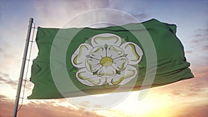 North Yorkshire flag, England, waving in the wind, sky and sun background