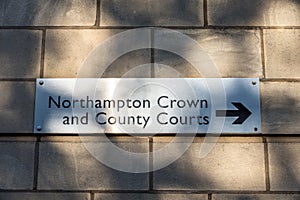 Northampton Crown and County Court name plate on a brick wall