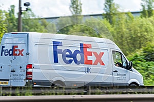 Northampton, UK - May 10th 2019: fedex uk delivery van on british motorway in motion