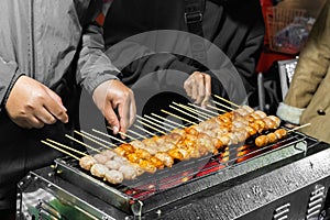 Northeastern Sausage,Thai street food. Thai sausage grilled on stall. Sai Krok Isaan or Pork sausage with rice grill. Made of pork