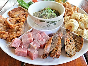 Northern food appetizer.Hors-d`oeuvre of Thai Northern food style placed on wooden table.