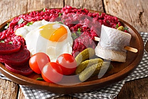 Northern German Labskaus of potatoes, corned beets and beets wit