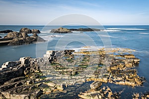 Northern Ireland Antrim Coast Ballintoy Harbour long exposure rocks sunset waves beautiful scenery