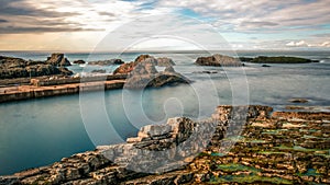 Northern Ireland Antrim Coast Ballintoy Harbour long exposure rocks sunset waves beautiful scenery