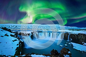 Northern Light, Aurora borealis at Godafoss waterfall in winter, Iceland