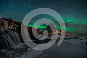 Northern Light, Aurora borealis at Kirkjufell in Iceland. Kirkjufell mountains in winter