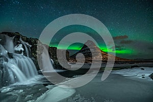 Northern Light, Aurora borealis at Kirkjufell in Iceland. Kirkjufell mountains in winter