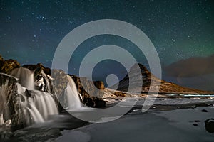 Northern Light, Aurora borealis at Kirkjufell in Iceland. Kirkjufell mountains in winter