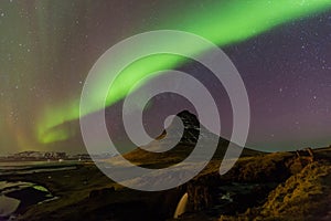 Northern Light over Kirkjufell volcano mountain night view