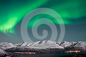 Northern lights above fjords in Norway