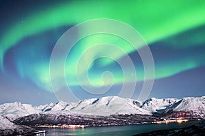 Northern lights above fjords in Norway