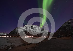 Northern lights above Mt. Himmeltinden in Lofoten islands