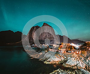 Northern Lights Aurora Borealis with classic view of the fisherman s village of Hamnoy, near Reine in Norway, Lofoten