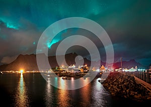 Northern Lights Aurora Borealis with classic view of the fisherman s village of Sakrisoy, near Reine in Norway, Lofoten