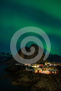 Northern Lights, Aurora Borealis, with classic view of Hamnoy, near Reine on Lofoten Islands, Norway, Scandinavia