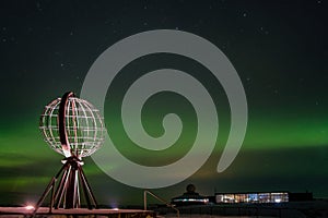 Northern lights, Aurora Borealis with the Globe, the monument at Nordkapp, North Cape, Norway photo