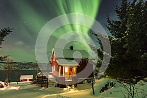 Northern lights Aurora Borealis in the night above a typically a