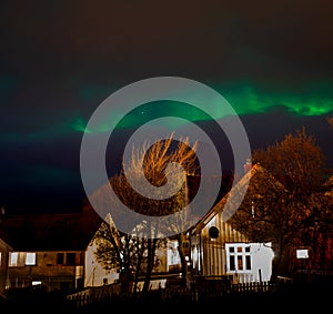 The Northern lights Aurora borealis over Reine, Norway