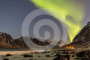 Northern lights in the clear night sky above Uttakleiv beach, Lo