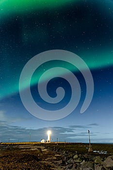 Northern Lights displaying above Grotta Island Lighthouse in the Icelandic capital, Reykjavic