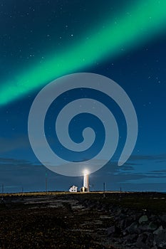 Northern Lights displaying above Grotta Island Lighthouse in the Icelandic capital, Reykjavic