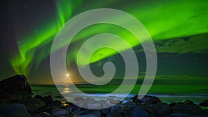 Northern lights and the moon at Uttakleiv Beach