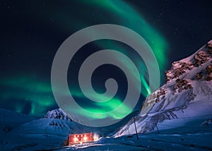 Northern lights in the mountains house of Svalbard, Longyearbyen city, Spitsbergen, Norway wallpaper photo