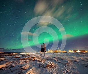 Northern Lights in the mountains of Reine, Norway. Lofoten Islands