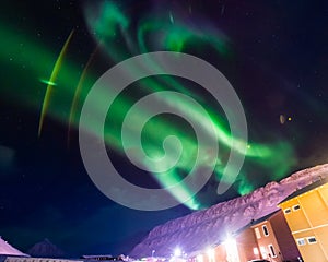 The Northern lights in the mountains of Svalbard, Longyearbyen, Spitsbergen, Norway wallpaper