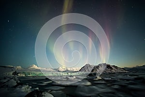 Northern Lights over the Arctic tidewater glacier - Spitsbergen, Svalbard