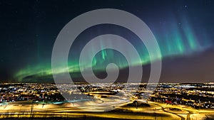 Northern lights over a city