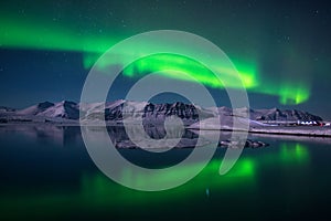 Northern lights over the glacier lagoon Jokulsarlon, Iceland