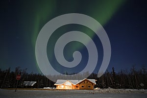 Northern Lights over house in southcentral Alaska photo