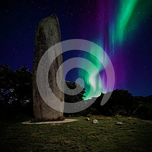 Northern lights over the Kerloas menhir, Bretagne (France)