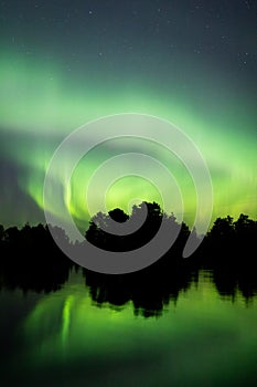 Northern lights over lake in Finland