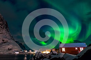 Northern Lights over Norwegian Houses