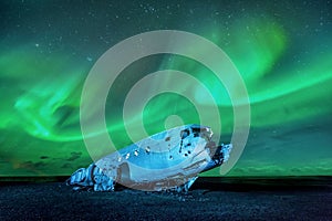 Northern lights over plane wreck in Iceland.