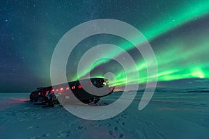 Northern lights over plane wreck on the wreck beach in Vik, Iceland