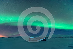 Northern lights over plane wreckage in iceland