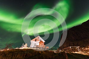 Northern lights over the Reine fishing village, Lofoten islands