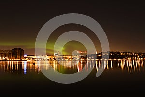 Northern lights over Stockholm City on a winter night in Sweden