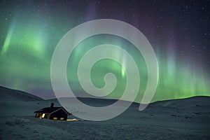 Northern lights in Reinheim Cabin, Dovrefjell National Park, Norway